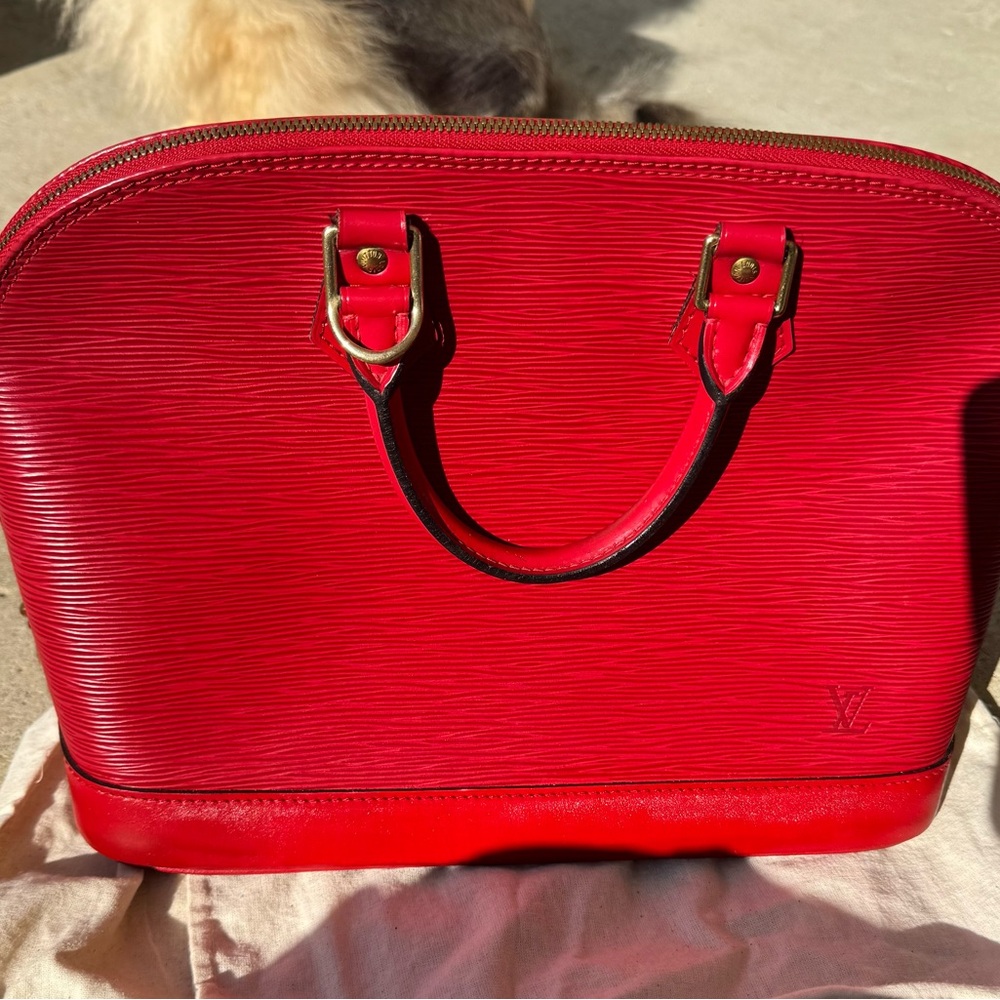 Louis Vuitton Alma top handle bag